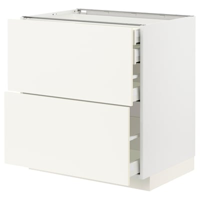 White METOD kitchen cabinet with semi-open drawers, sleek modern design.