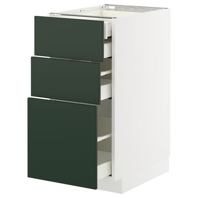 Modern white kitchen unit with 3 dark green pull-out drawers, smooth fronts.