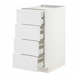 White METOD kitchen unit with four partially open drawers, sleek and modern design.