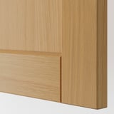 Close-up of smooth, high-quality oak-veneered kitchen cabinet with beveled edges, highlighting craftsmanship and finish.