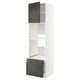 Modern white kitchen unit with dark grey drawers and shelves. Tall, slim, with open storage.