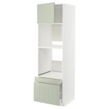 An ikea METOD kitchen unit with light green stensund fronts, featuring drawers and adjustable shelves.