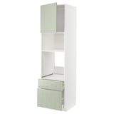 A METOD kitchen unit with green stensund fronts, featuring cabinets and a drawer in a white and green color scheme.
