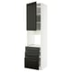 A white METOD kitchen cabinet with black bodbyn fronts, featuring a tall unit with a door and multiple drawers.