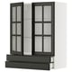 Modern black glass-front kitchen cabinet, part of the METOD system, featuring sleek beveled edges and multiple adjustable shelves.