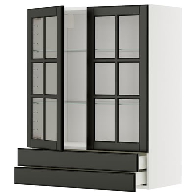 Modern black glass-front kitchen cabinet, part of the METOD system, featuring sleek beveled edges and multiple adjustable shelves.