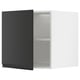 A black METOD kitchen cabinet with two shelves and a reversible door.