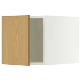 A white kitchen cabinet with a wooden door. The door has hinges and is open, revealing the interior.