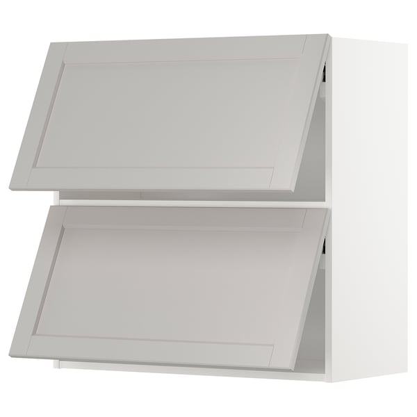 A light grey METOD kitchen cabinet with a traditional design. It two rectangular doors with beveled edges and a sturdy frame.