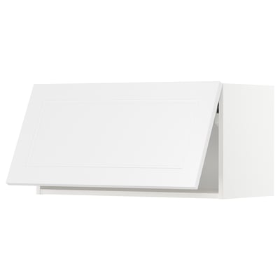 White METOD kitchen cabinet with angled design, sleek modern look.