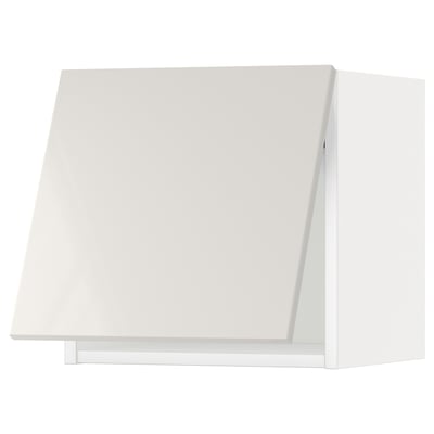 White ikea METOD kitchen cabinet, modern and glossy with vertical handle.