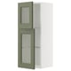 A green and white kitchen cabinet from the METOD system with glass doors. The design a tall, slim shape with adjustable shelves.