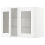 White METOD kitchen cabinet with glass doors, modern minimalist design.