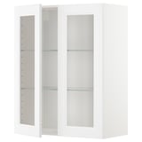 A white METOD kitchen cabinet with glass doors and adjustable shelves.