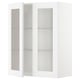 A white METOD kitchen cabinet with glass doors and adjustable shelves.