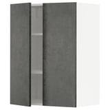 A dark grey concrete effect METOD kitchen cabinet with one door open, revealing shelves inside.