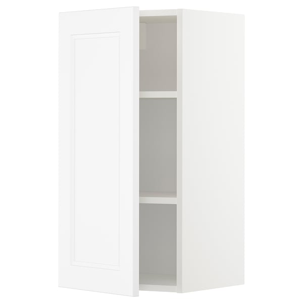 A white METOD wall cabinet with a rectangular design and adjustable shelves.