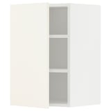A white METOD wall cabinet from ikea with three shelves. Its rectangular and has a simple, modern design.