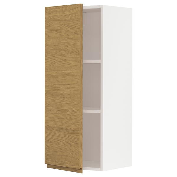 Ikea METOD white cabinet with oak door open.