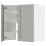 A light grey METOD kitchen cabinet with beveled edges, featuring adjustable shelves and snap-on hinges.