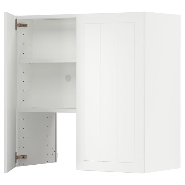 A white METOD kitchen cabinet with adjustable shelves and doors.