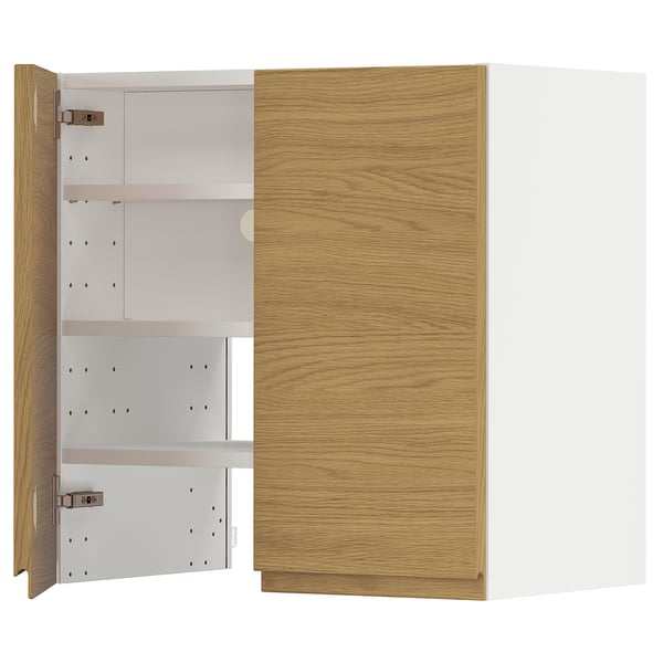 A METOD kitchen unit with oak-style doors and white interior shelving.