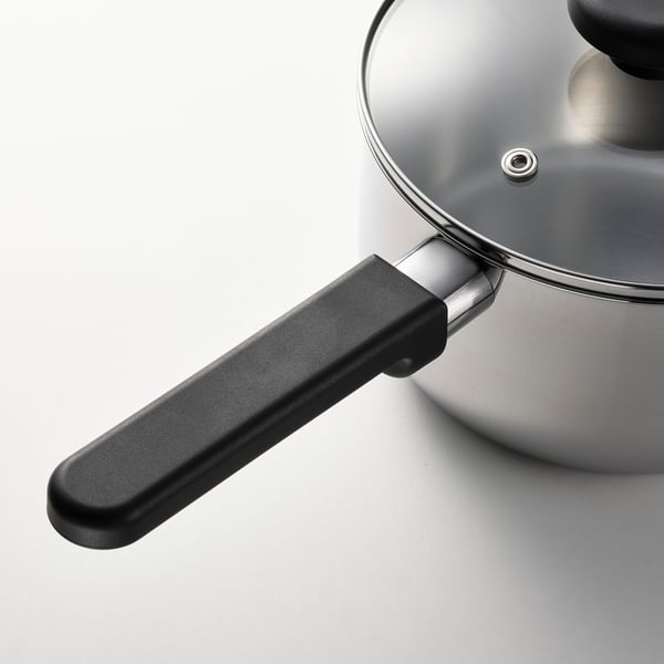 Modern saucepan with black handle and glass lid, designed for even heat distribution and easy cleaning.