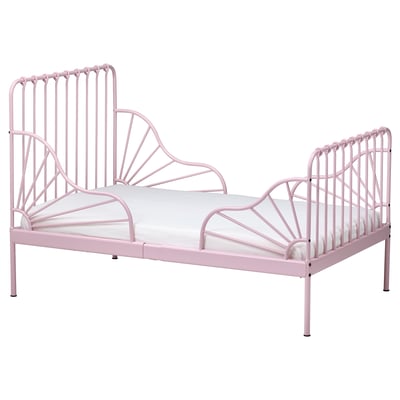 A pink MINNEN metal bed with a white mattress, designed for children. The bed has a decorative, heart-shaped headboard and footboard.