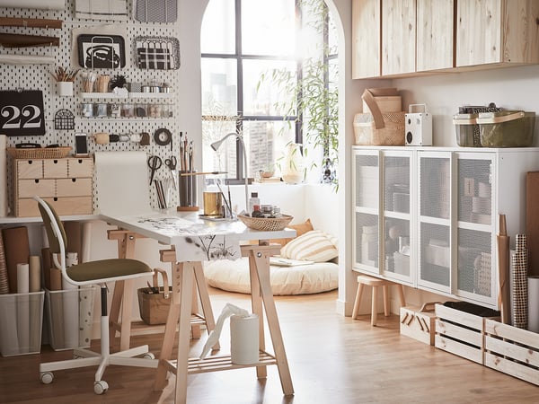 Modern workspace with wooden desk, tilt function, and decor.