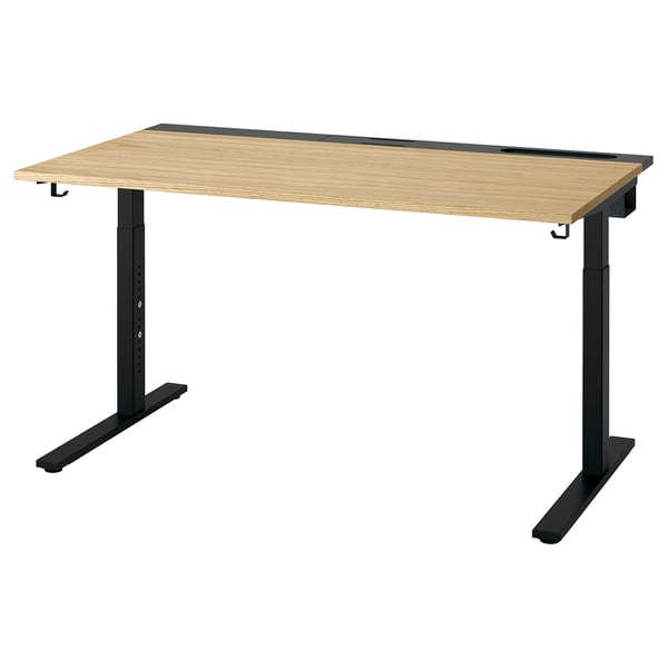 MITTZON adjustable desk. Light wood top, black legs, sleek design. Height-adjustable, includes cable tray.