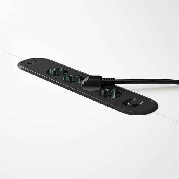 Black conference table module with usb ports and cable, designed for office use.