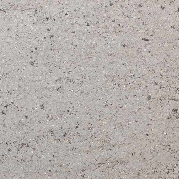 Close-up of high-pressure porcelain worktop, smooth texture, speckled pattern, showcasing durability and hygiene.