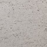 Close-up of high-pressure porcelain worktop, smooth texture, speckled pattern, showcasing durability and hygiene.