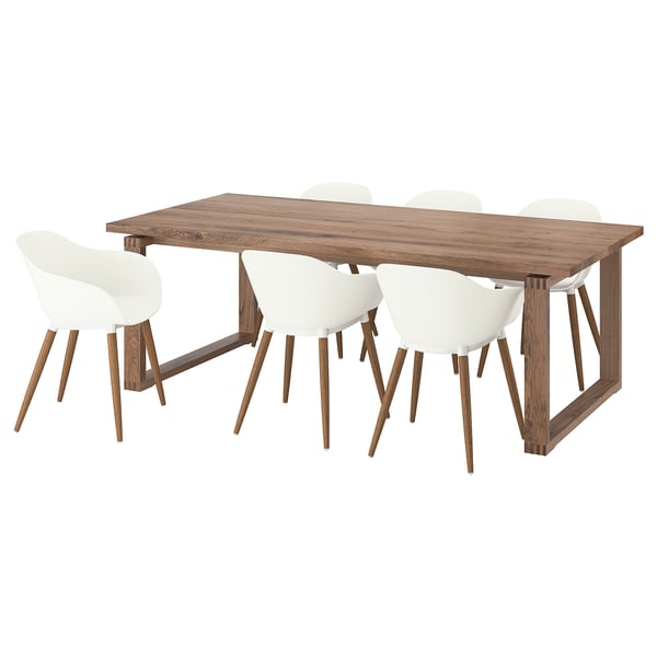 A MÖRBYLÅNGA dining set with a rectangular wooden table and four white chairs.