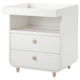 White MYLLRA changing table. Modern minimalist design with two drawers, wood knobs, and legs.