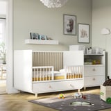 Childs room with MYLLRA cot & storage, decorated with photos & toys.