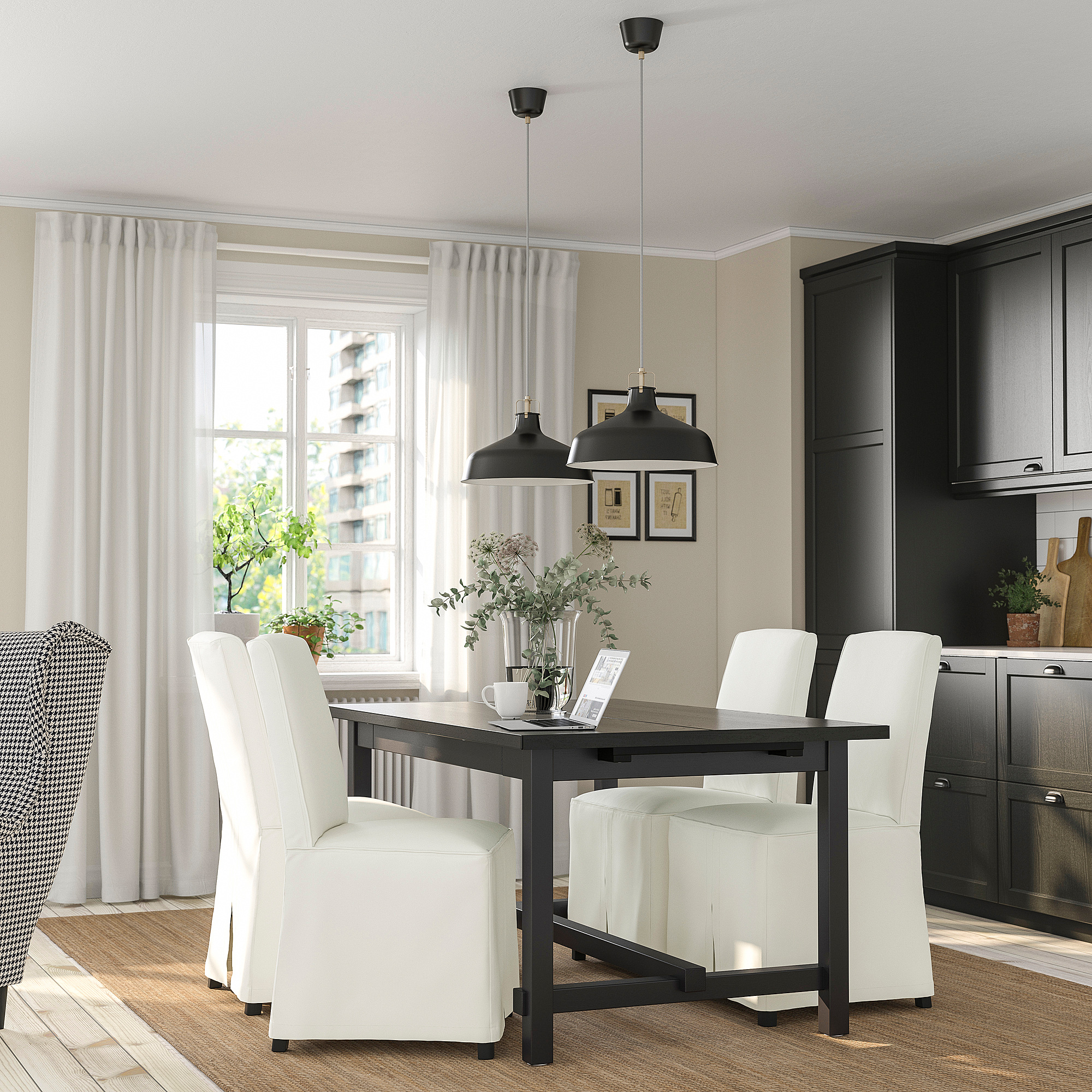 Modern dining room with extendable table, white chairs, large window, plant.