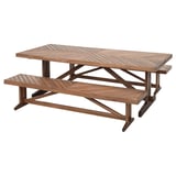Brown wooden outdoor dining table with attached benches, made of acacia wood.