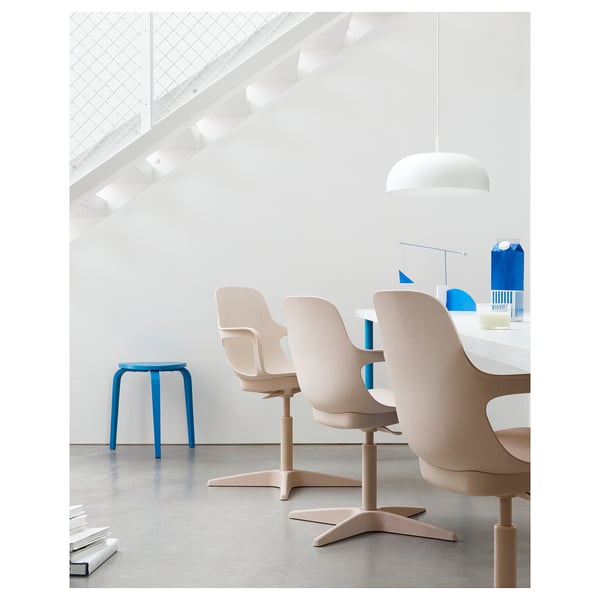 Minimalist office with ODGER chairs, blue stool, natural light.