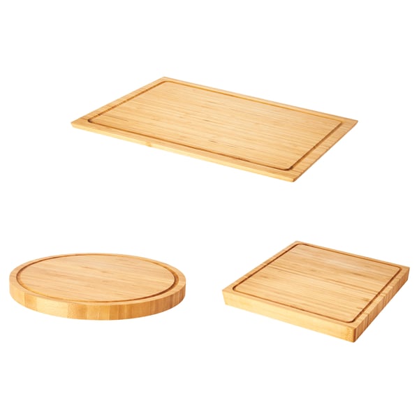 Three OLEBY bamboo chopping boards in rectangular and circular shapes, light brown color, arranged neatly on a white background.