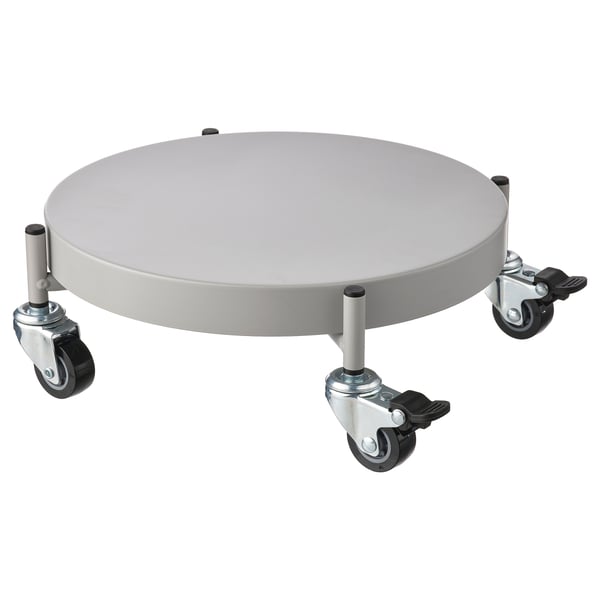 A white OLIVBLAD plant mover with four wheels and a circular tray. This versatile plant stand allows easy rolling and locking for stability.