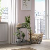 OLIVBLAD plant stand with three shelves and potted plants near windows and cozy rug, wicker basket, and radiator.