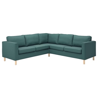 An l-shaped PÄRUP sofa in green corduroy with wooden legs, modern and cozy design.