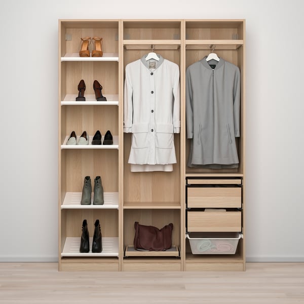 Organized closet with hanging clothes, shelves for shoes, and drawers.