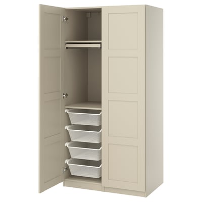 An open beige PAX wardrobe with two doors, containing wire storage baskets and drawers.