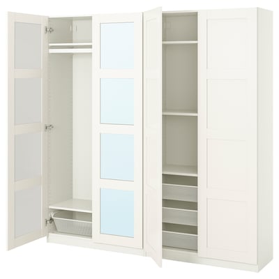A white ikea PAX wardrobe with open doors, revealing an empty interior and mesh drawers.