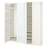 A white PAX wardrobe with open doors revealing mirrored panels and shelves.