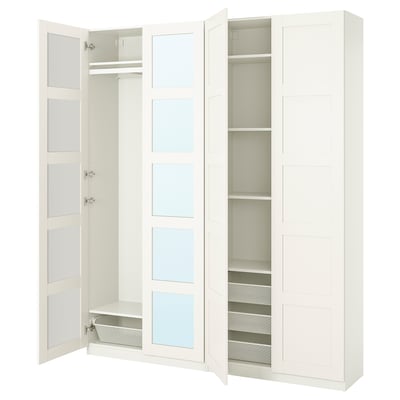 A white PAX wardrobe with open doors revealing mirrored panels and shelves.