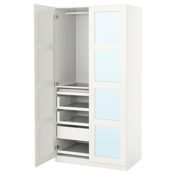 An open white PAX wardrobe with drawers and shelves.