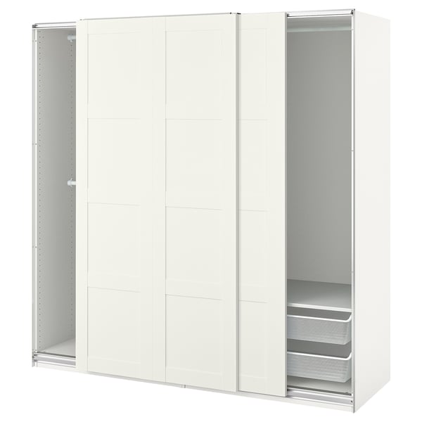 A white ikea PAX wardrobe with sliding doors and mesh drawers.